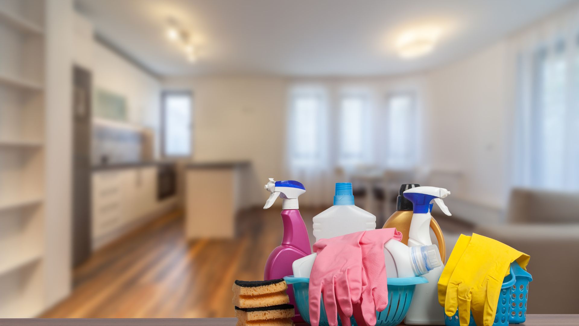 A bunch of cleaning supplies sitting on top of a wooden table